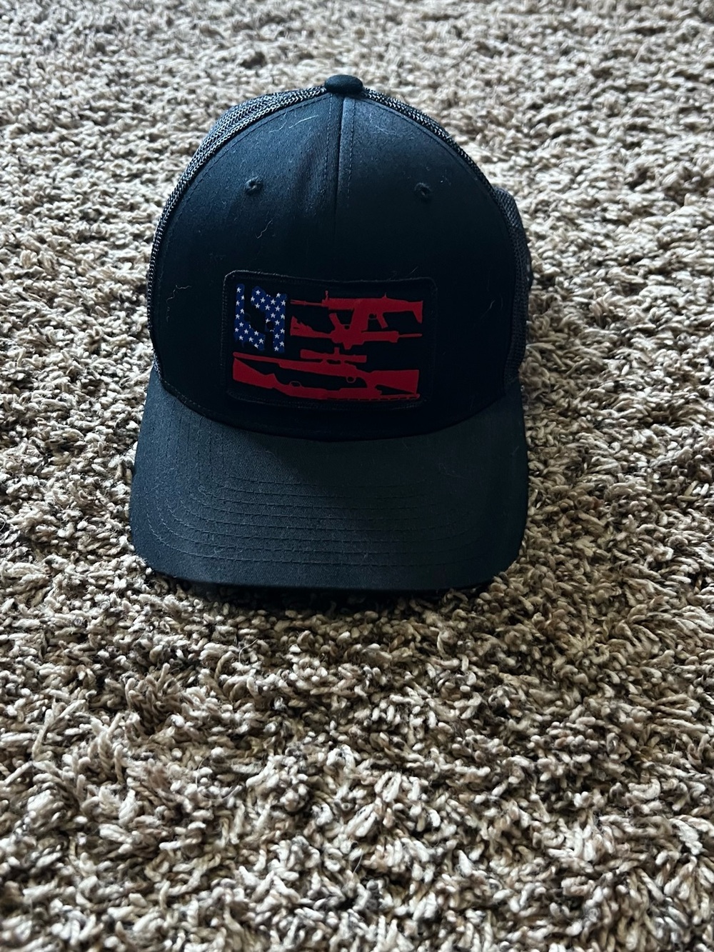 Black Trucker Hat with Red & Blue Patch